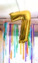 Gold balloon number 7. Child& x27;s birthdayparty decor in rural interior Royalty Free Stock Photo