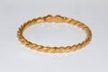 Gold bangle and bracelet on white background Royalty Free Stock Photo