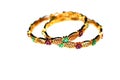 Gold bangles with green and pink rubies