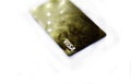 Gold bank card on a white background