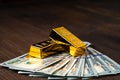 gold bar on dollar bills, Investing in real gold than gold bullion. Money and Gold, Financial concept Royalty Free Stock Photo