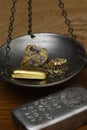 Gold Bar & Nuggets in Balance Scale - Silver Bar (foreground) Royalty Free Stock Photo