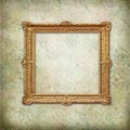 Gold baroque empty frame on Victorian wallpaper