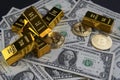 Gold bars and american one dollar bills. Scattered bitcoin digital cryptocurrency coin.