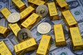 Gold bars and american one dollar bills. Scattered bitcoin digital cryptocurrency coin.