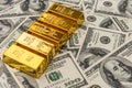 Gold bars bullions lying on 100 dollar bills Royalty Free Stock Photo