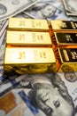 gold bars over dollar money bills, investment saving concept Royalty Free Stock Photo