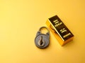 Gold bars and vintage padlock. Financial concept and conceptual image