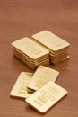 Gold Bars on Wood Surface