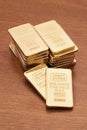 Gold Bars on Wood Surface