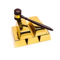 Gold bars with wooden auction gavel on white background Royalty Free Stock Photo