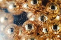 Gold beads in the wine glass with water, bubbles, macro, photo, background for design