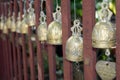 Gold Bell hanging on fence in thai temple