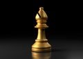 Gold bishop chess, standing against black background