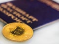 Gold bitcoin, in the background, dollars, decreasing chart, close-up Royalty Free Stock Photo