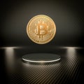 Gold bitcoin coin on carbon fiber podium Royalty Free Stock Photo