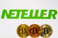 Gold Bitcoin coins with the Neteller logo Royalty Free Stock Photo