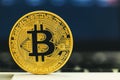 Gold bitcoin cryptocurrency with a latop Royalty Free Stock Photo