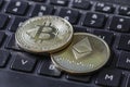 Gold Bitcoin and Etherium Token On Keyboard Royalty Free Stock Photo