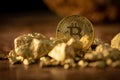 Gold bitcoin physical and Gold nugget grains. Concept mining cry