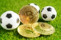Gold bitcoin with soccer ball or football, cryptocurrency used in online sports betting
