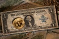 Gold Bitcoin on top of antique on Dollar banknote. Silver Certificate Dollar