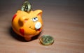 Piggy bank with bitcoins. Earnings on the Internet. Advertising photography