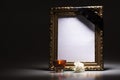 Gold, blank mourning frame with candle and carnation