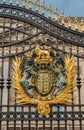 Gold blazed Coat of arms at gate of Buckingham Palace, London, UK Royalty Free Stock Photo