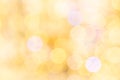 Gold bokeh background. Abstract glitter festive blur lights. Soft yellow christmas backdrop. Royalty Free Stock Photo