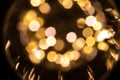 Gold bokeh background. Abstract glitter festive blur lights. Soft yellow christmas backdrop. Royalty Free Stock Photo