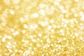 Gold bokeh texture. Festive glitter background with defocused lights