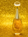 gold bottle parfume close-up dior bokeh background