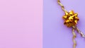 Gold bow on pink, violet background.