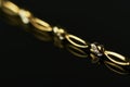 Gold Bracelet on Black Background Royalty Free Stock Photo