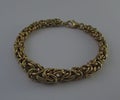 Gold Bracelet. Elegant Jewelry Golden Bracelet Made of Gold Wire.