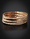 Gold bracelet isolated on black background Royalty Free Stock Photo