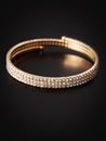 Gold bracelet isolated on black background Royalty Free Stock Photo