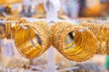 Gold bracelets in a showcase at a bazaar in Dubai.