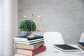 Gold brass balance scale on books in lawyer`s office. Symbol of law and justice Royalty Free Stock Photo