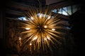 Gold brass copper chandelier, round consisting of gold spikes, rays. Modern beautiful rich design of pendant lamp