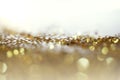 Gold bronze glitter shine dots confetti. Abstract light blink sparkle defocus backgound