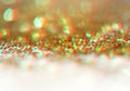 Gold bronze glitter shine dots confetti. Abstract light blink sparkle defocus backgound Royalty Free Stock Photo