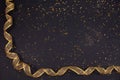 Gold bronze metallic ribbon on glitter background