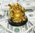 Gold Buddha on dollars Royalty Free Stock Photo