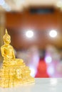Gold Buddha statue on the table. symbol of Buddhism religion in Thai wedding ceremony.