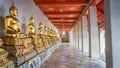 The gold Buddha statue in thai temple corridor, Bangkok Thailand Royalty Free Stock Photo