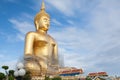 Gold buddha statue under construction in Thai temple with clear sky.WAT MUANG, Ang Thong, THAILAND. Royalty Free Stock Photo