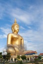 Gold buddha statue under construction in Thai temple with clear sky.WAT MUANG, Ang Thong, THAILAND. Royalty Free Stock Photo