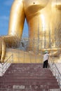 Gold buddha statue under construction in Thai temple with clear sky.WAT MUANG, Ang Thong, THAILAND. Royalty Free Stock Photo